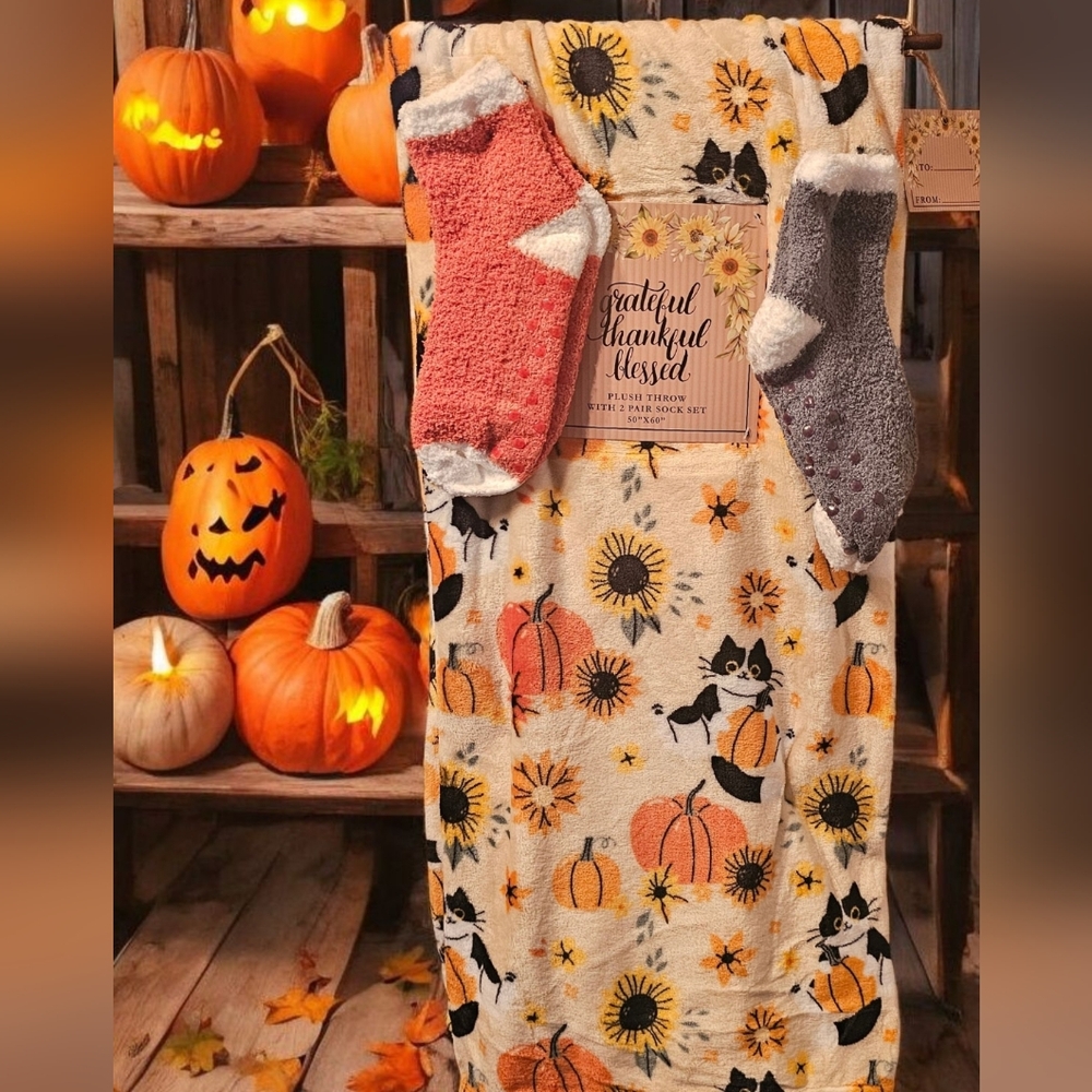 Cozy fall blanket featuring cats, pumpkins and flowers. NWT, size 50 x 60.